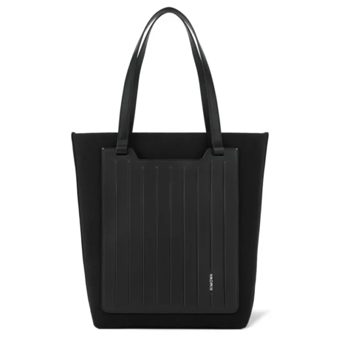 Never Still Vertical i läder och canvas TrageBags